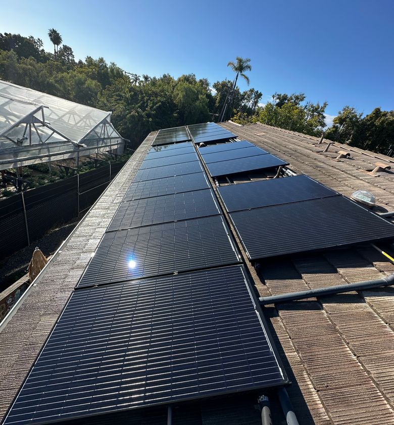 cleaned solar panels on top of a roof