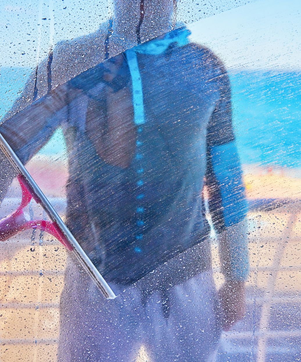 person washing a window